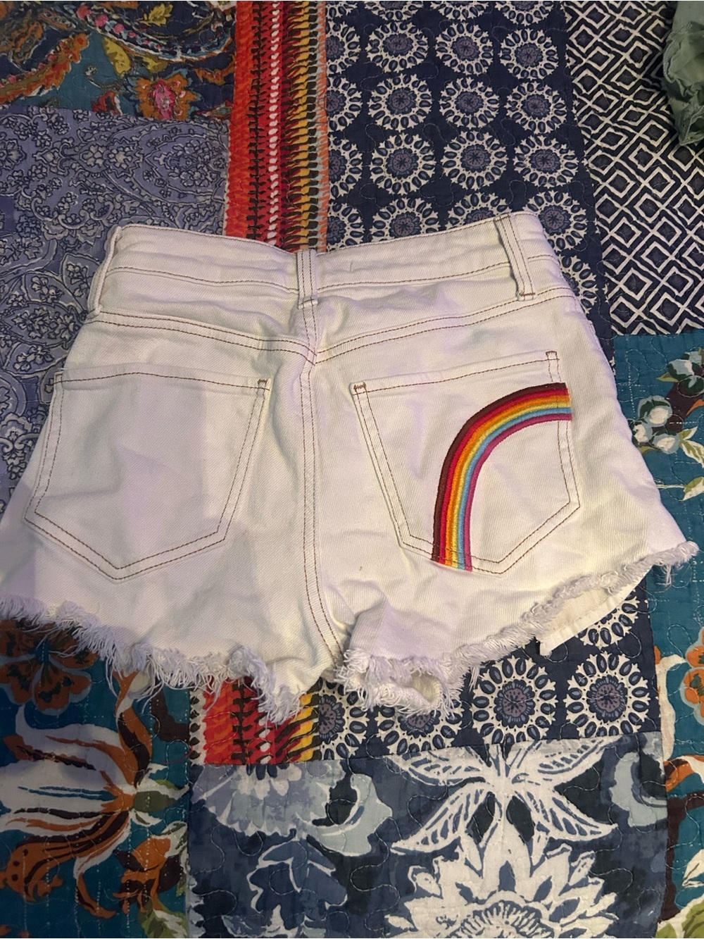 White Distressed Women’s Denim Shorts with rainbow on back pocket